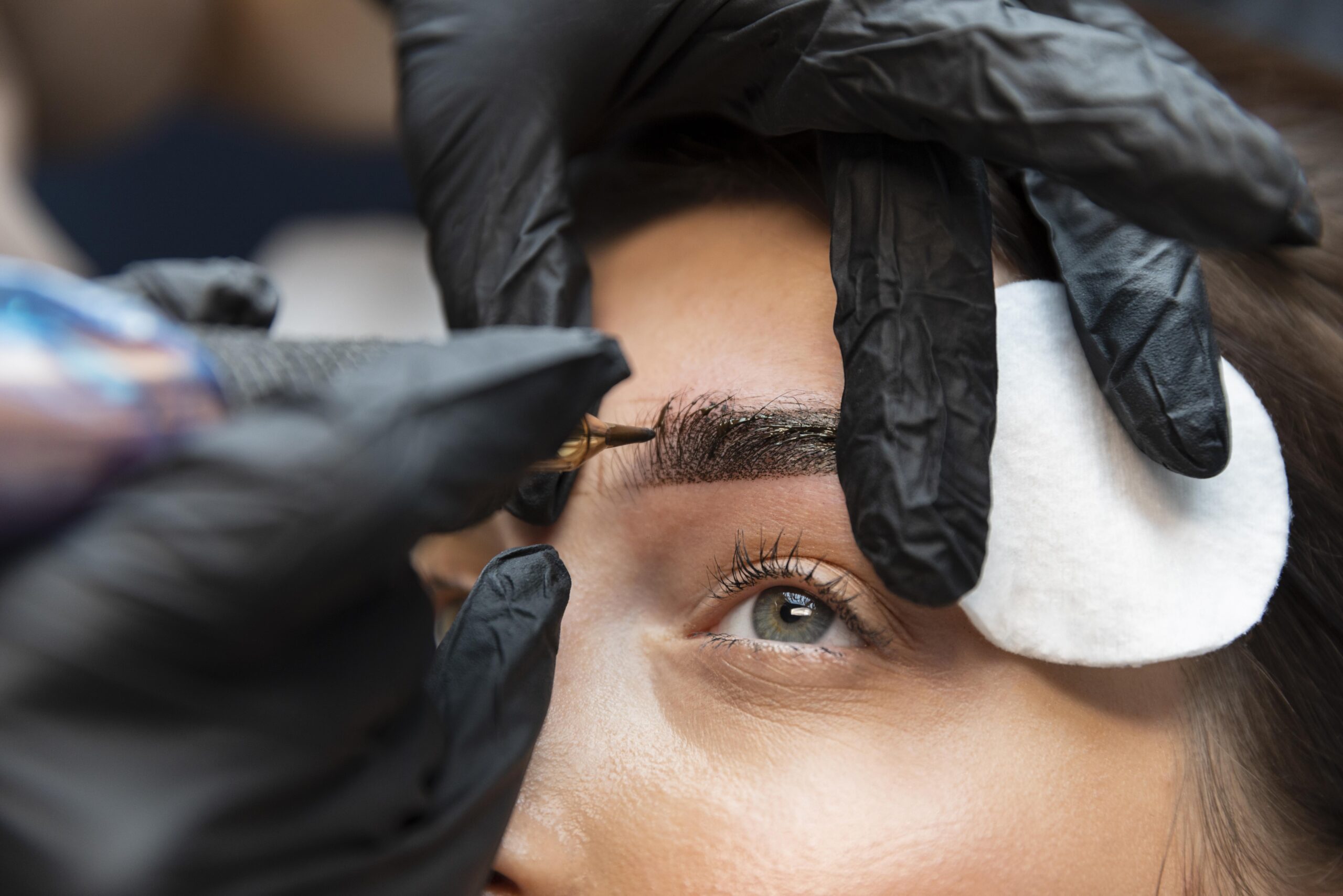 young-woman-getting-beauty-treatment-for-her-eyebrows